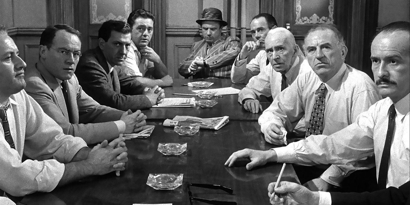 The 12 jurors sitting at the table in 12 Angry Men