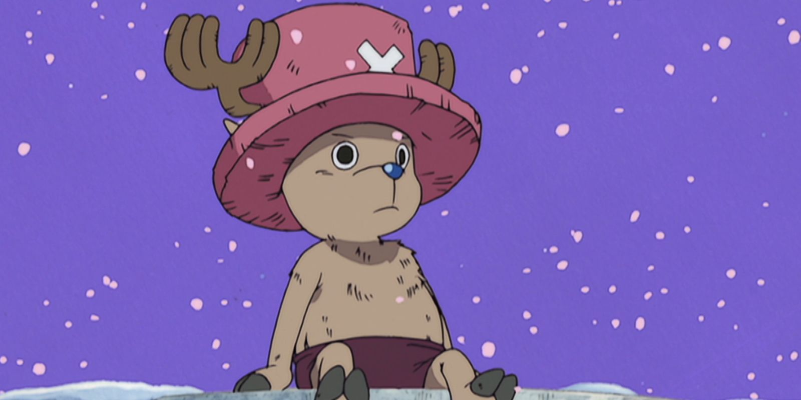 Chopper dari One Piece duduk di langkan saat di sekelilingnya turun salju.