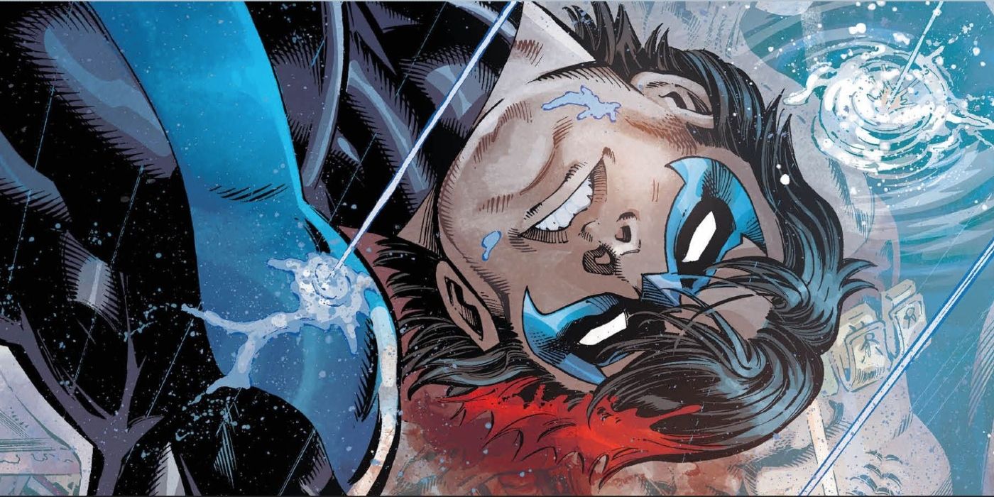 Nightwing terbaring berdarah di genangan air setelah ditembak di kepala oleh KGBeast